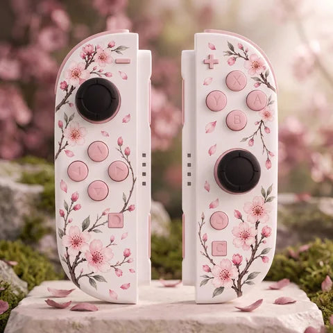 White cherry blossom Switch 2 Joy-Con pair with blush pink controls in a spring garden setting